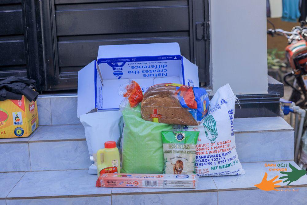 A complete food package — posho, flour, bread, sugar, and oil — for each family.