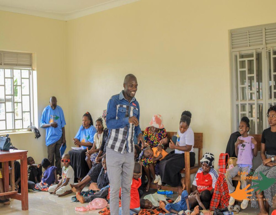 A facilitator addresses the group before the distribution begins