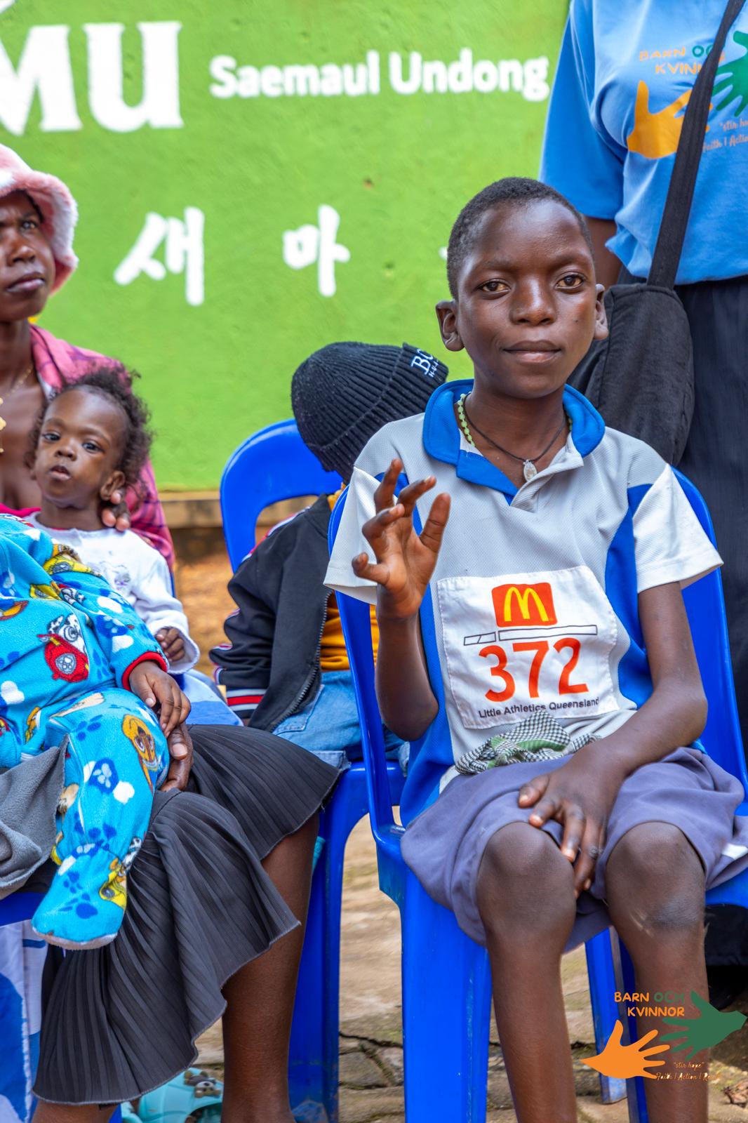 Young boy receiving support