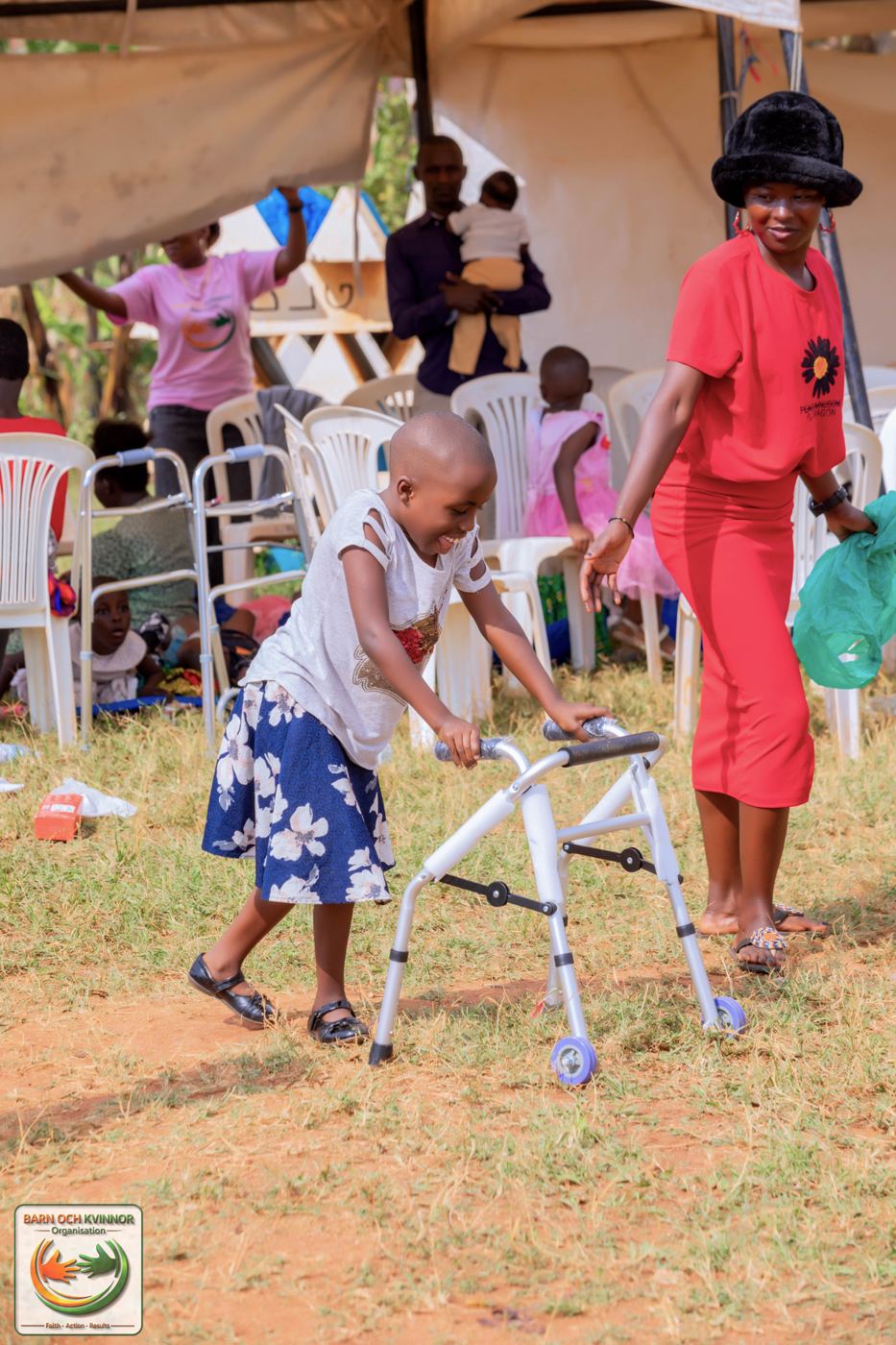 A child takes confident steps with the help of a new walking frame.