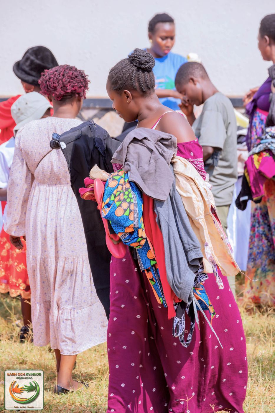 Donated clothing sorted and carried to waiting families.
