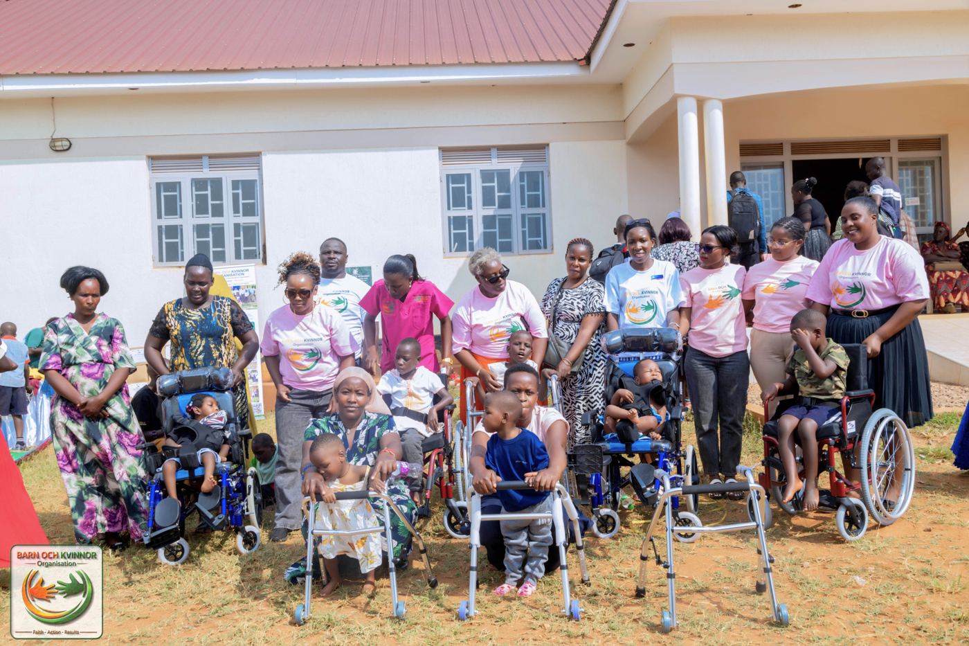 Some of the beneficiaries and their families pose with the mobility devices provided at the outreach.
