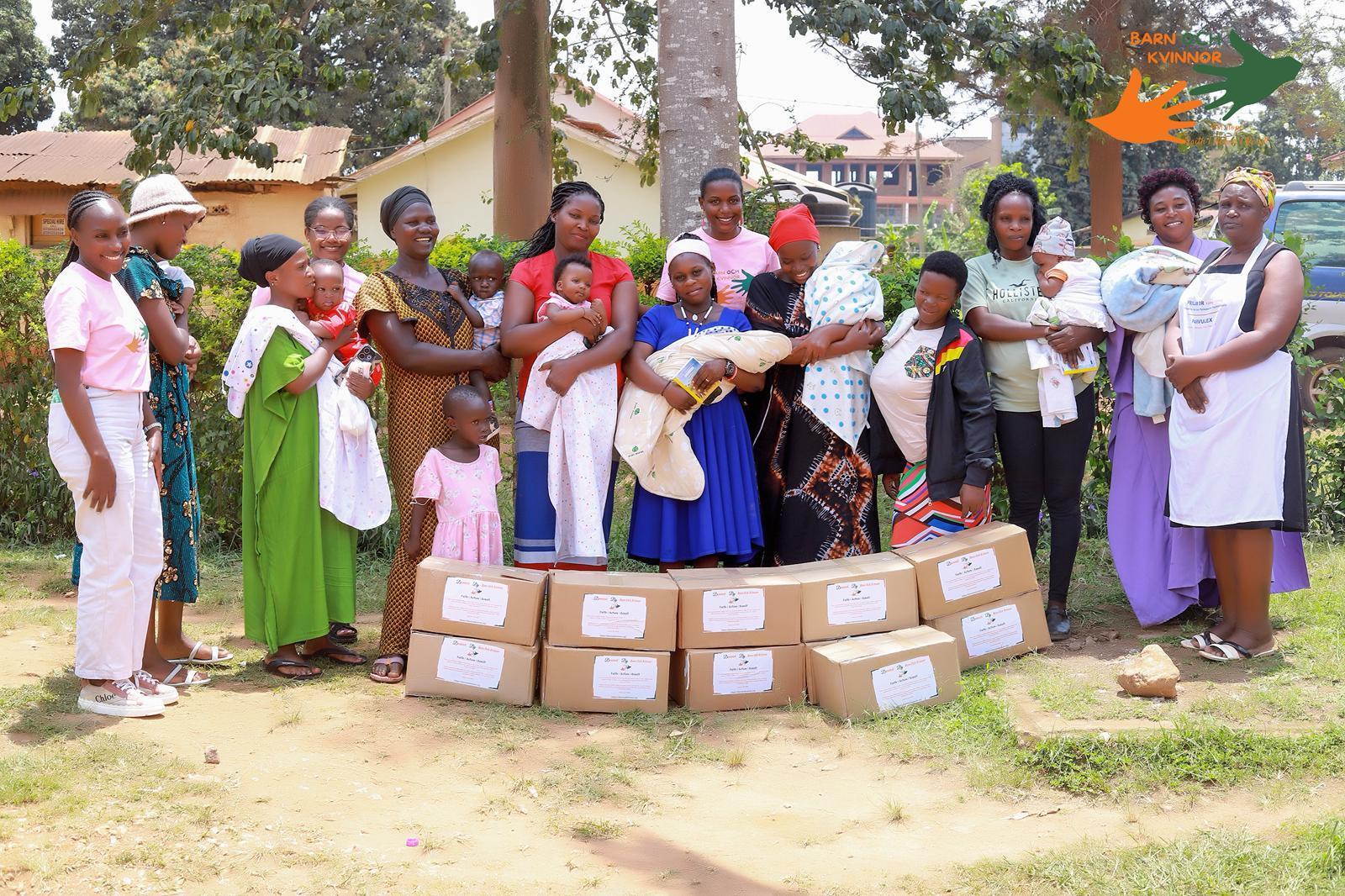 Mothers and nurses with boxes of baby milk outdoors