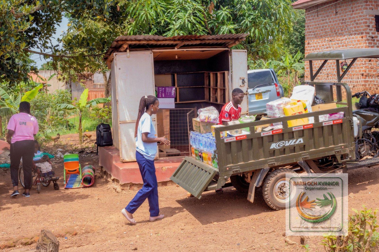 A stocked kiosk with a delivery tricycle during Agnes start-up support