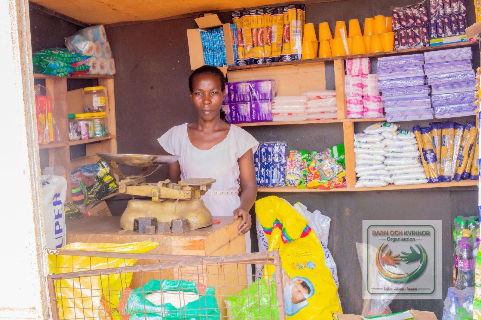 Agnes behind the counter in her stocked shop