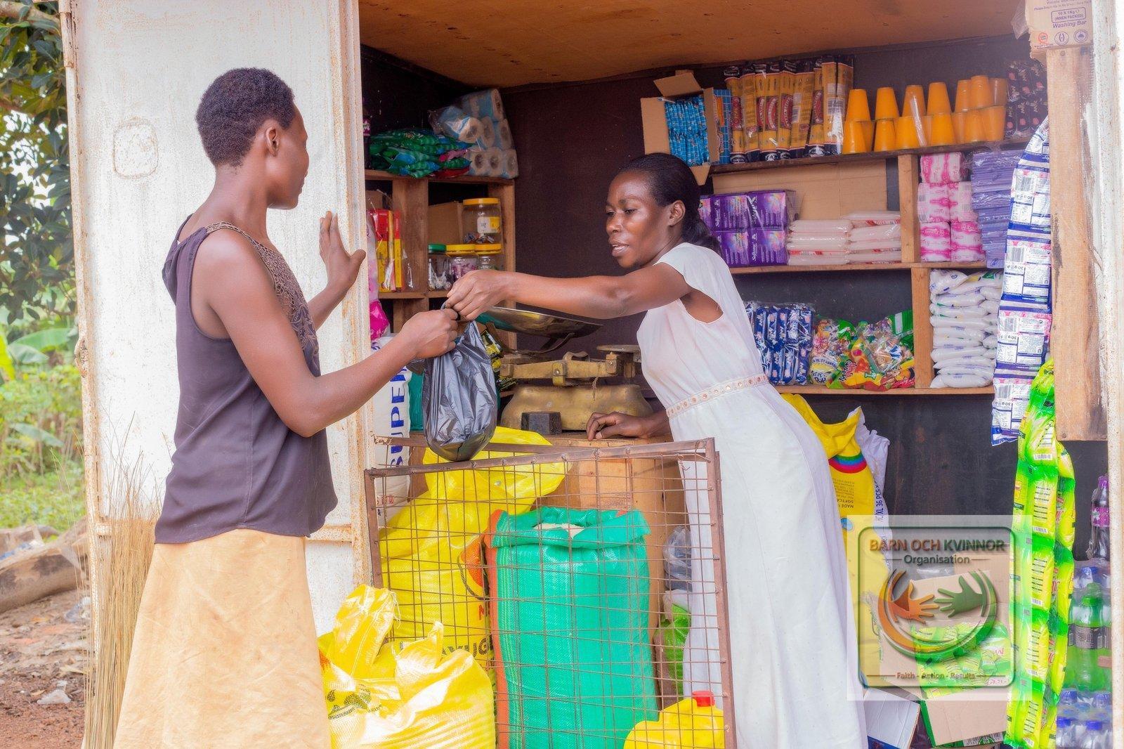 Agnes serving a customer at her shop
